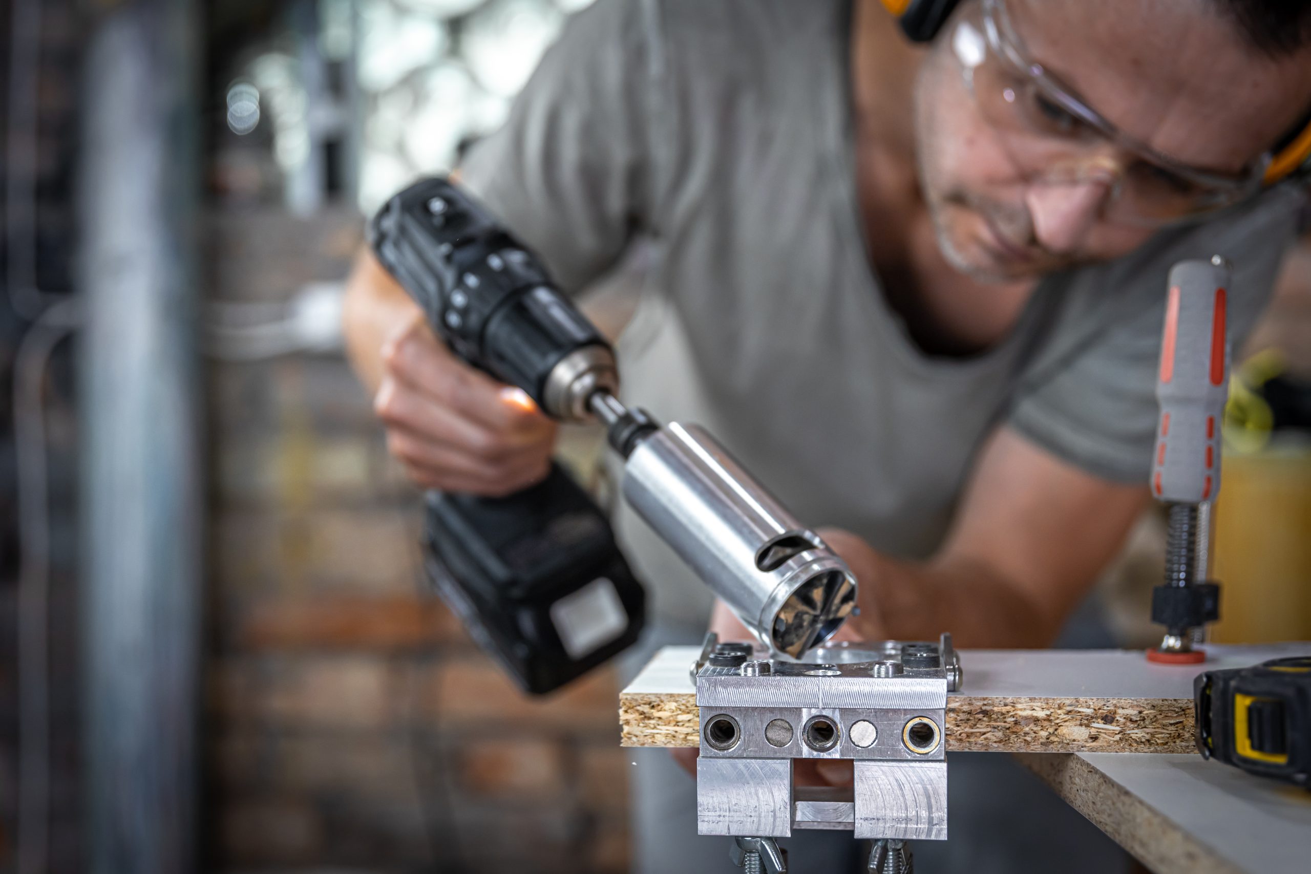 a carpenter works with professional woodworking tools.